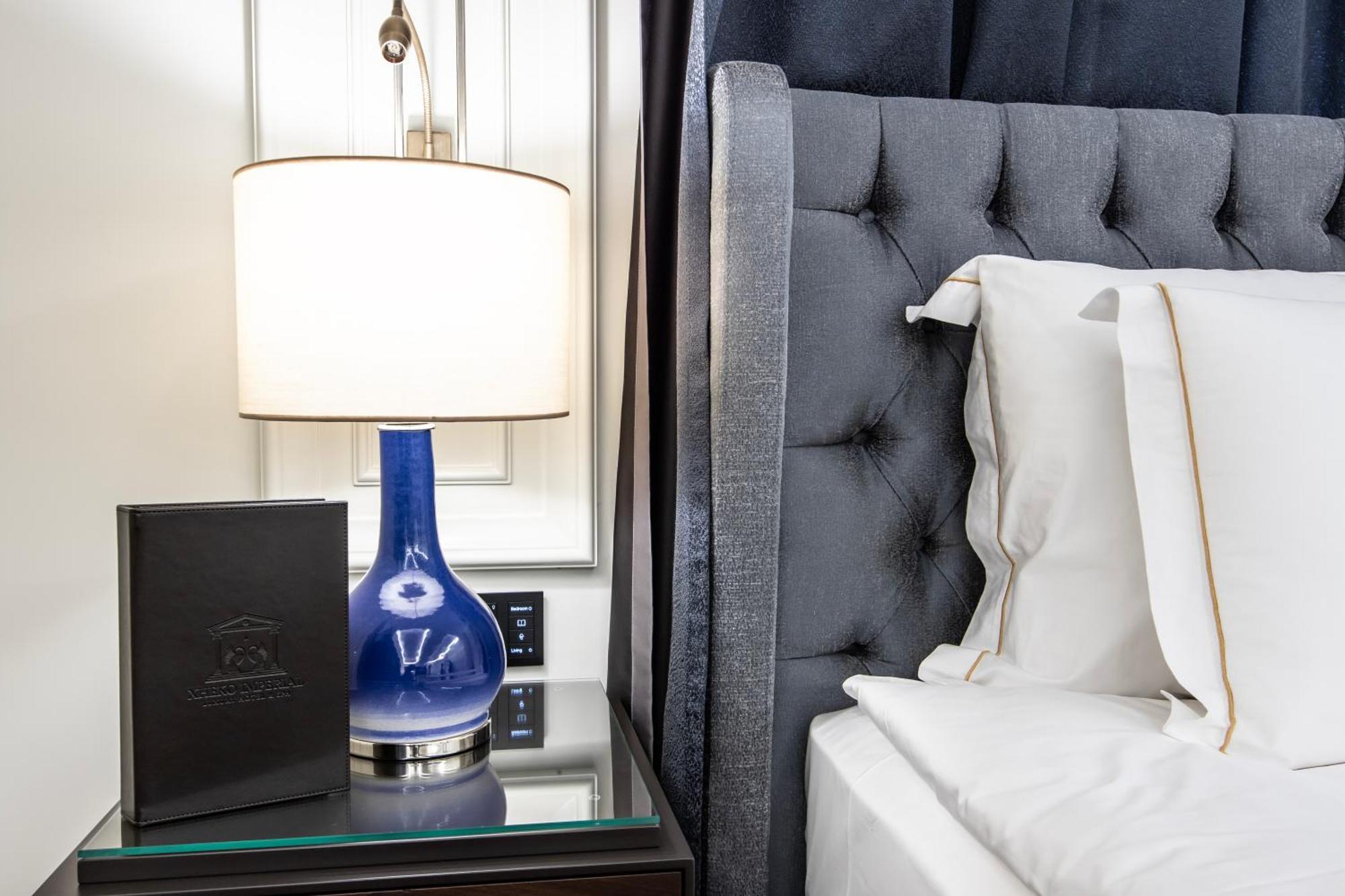 Xheko Imperial Luxury Hotel & Spa Tirana Exterior photo A lamp on a bedside table